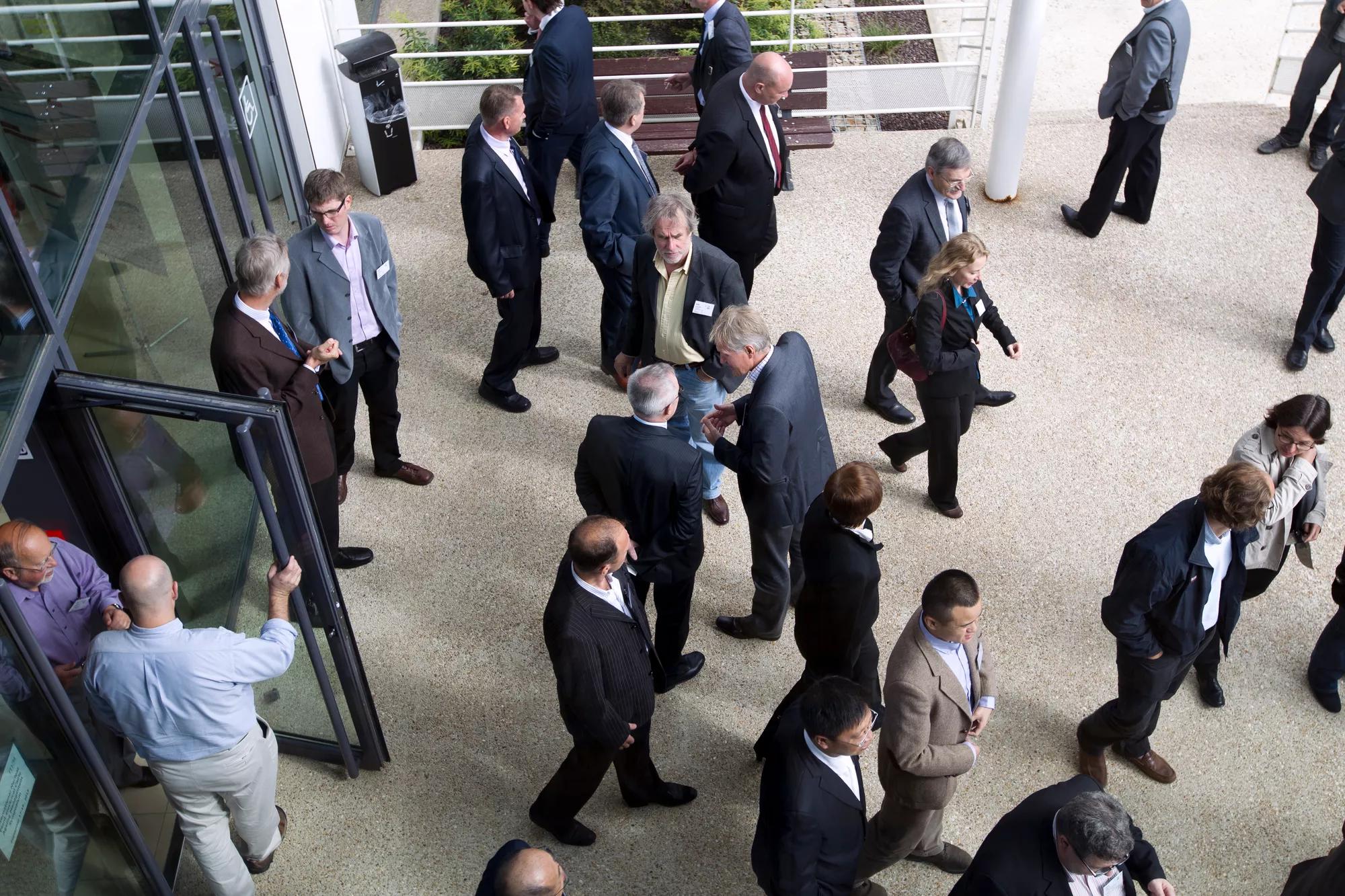 Office workers walking through office building using business access control system