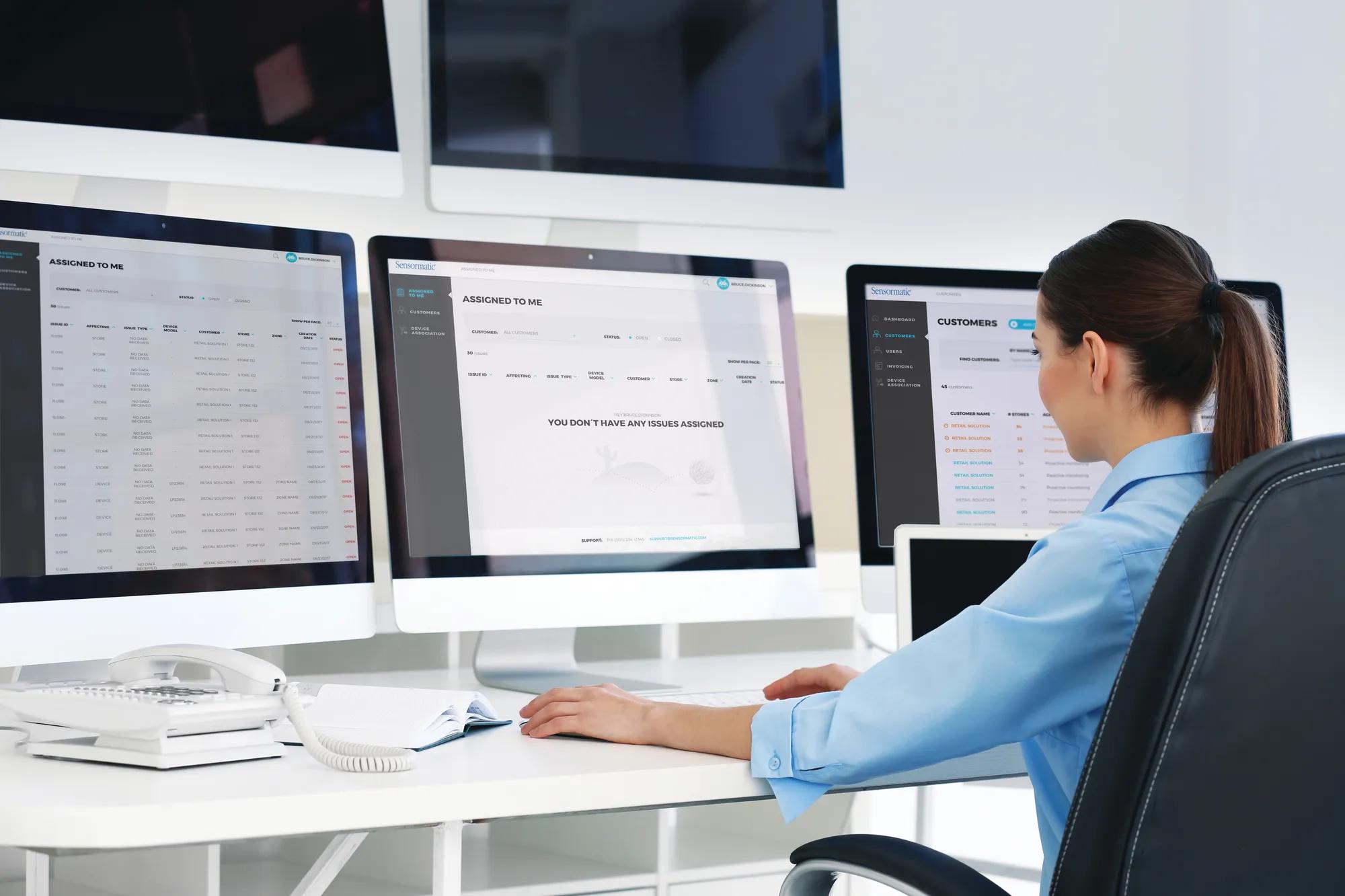 employee managing professional business security solutions on a desktop computer