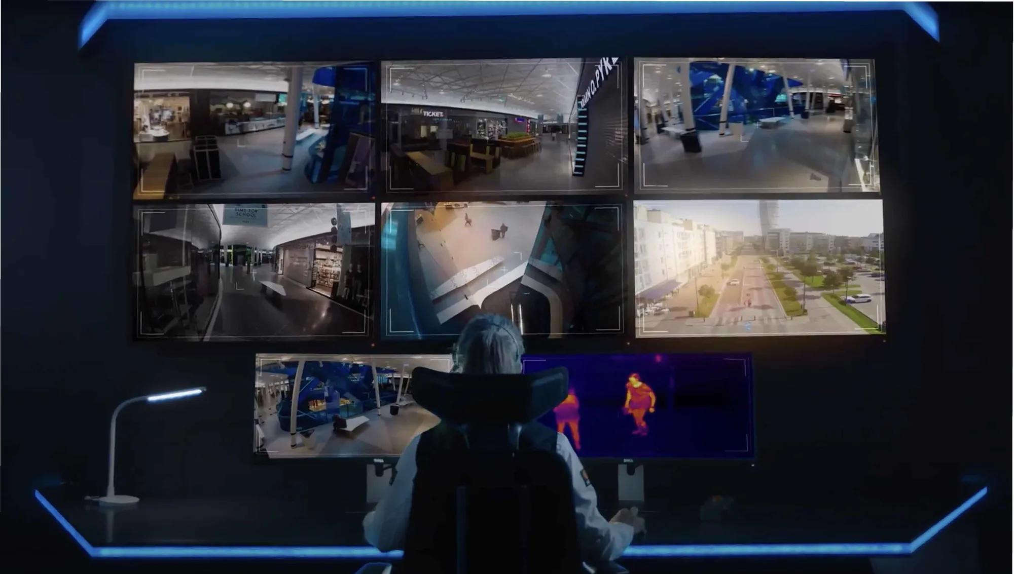 Image of a control center with agents using advanced video surveillance and audio technology