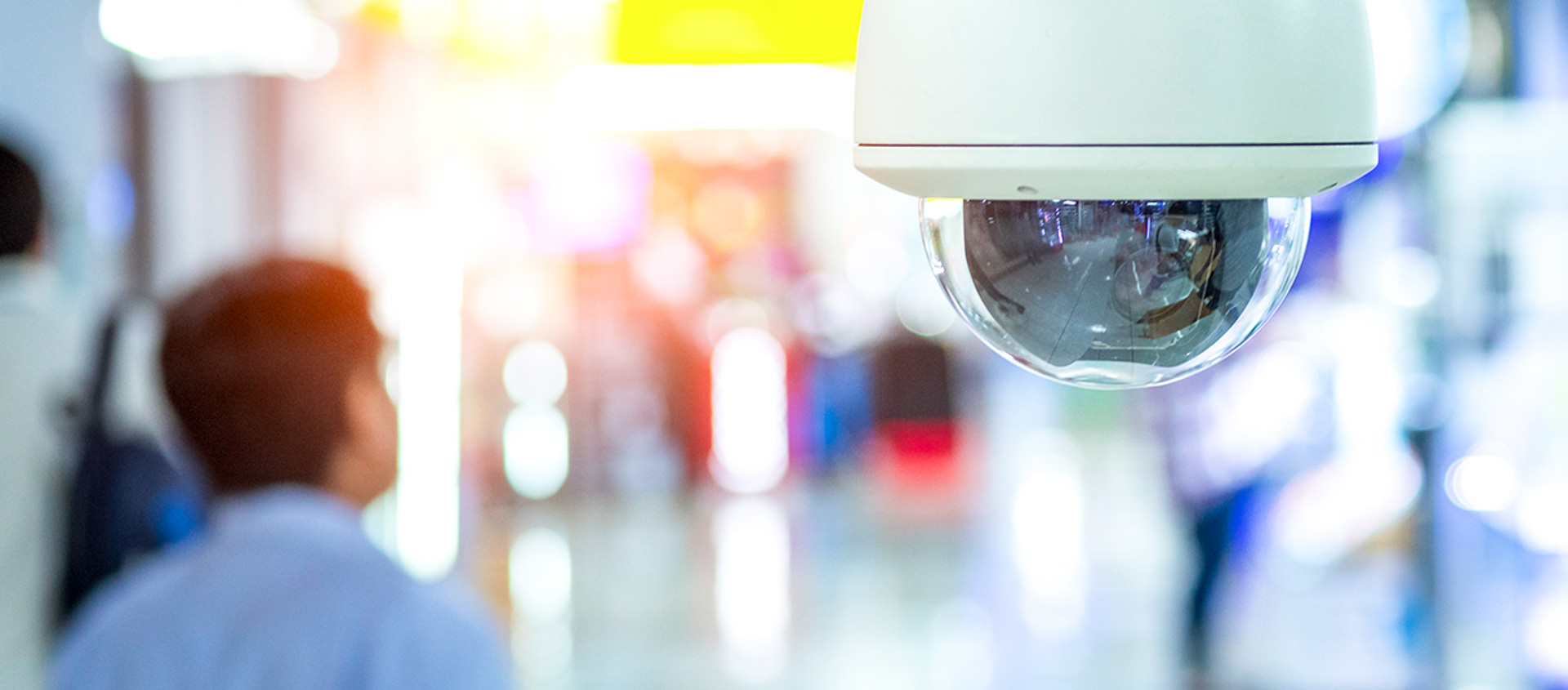 Security camera on ceiling of hallway