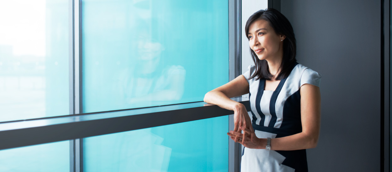 Woman looks out window