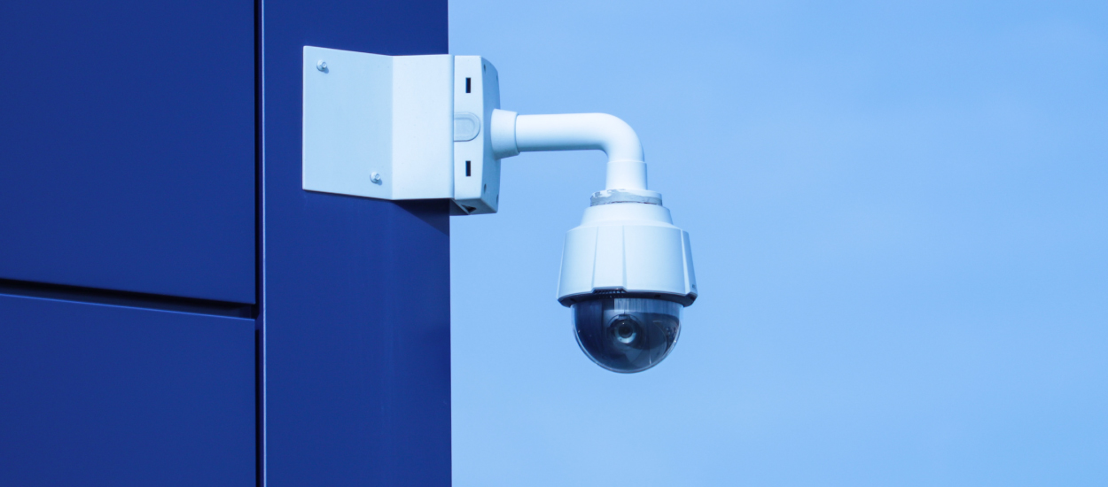 Video camera mounted on blue building