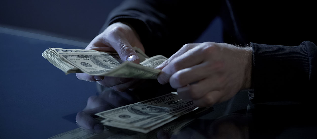 Close up of hands counting money