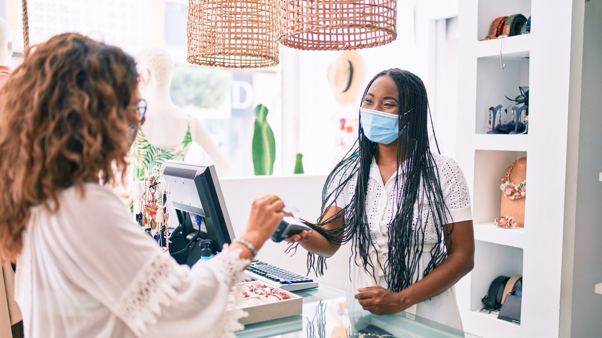 Woman working the register in boutique shop