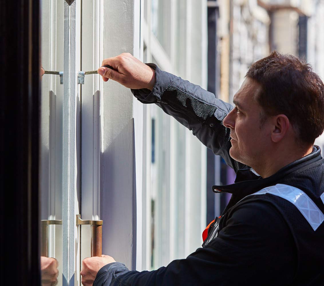 Professional keyholder unlocks door