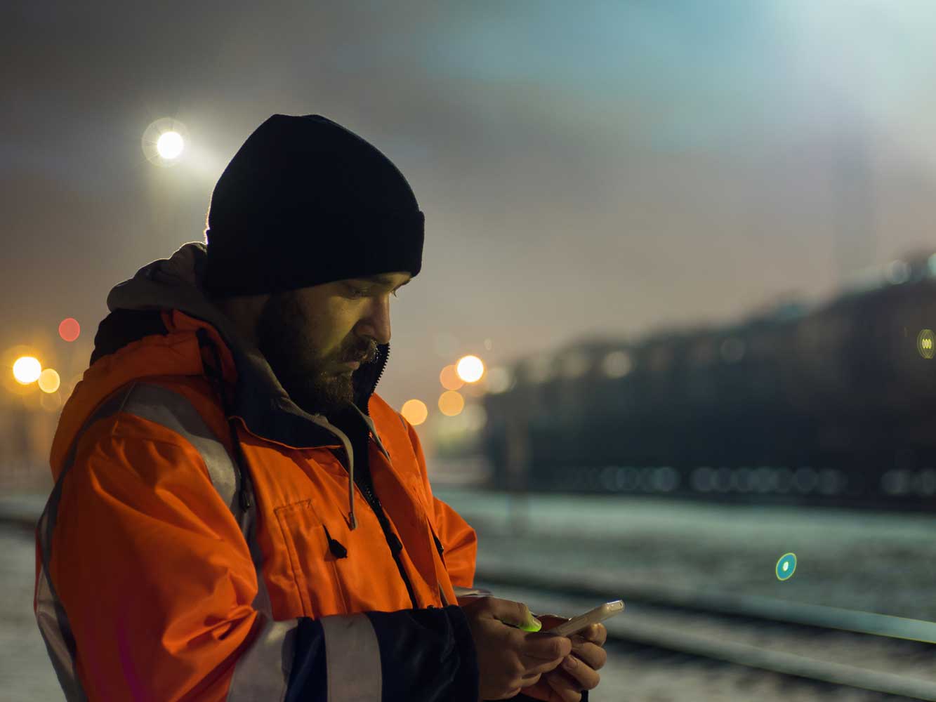 Worker uses phone outside