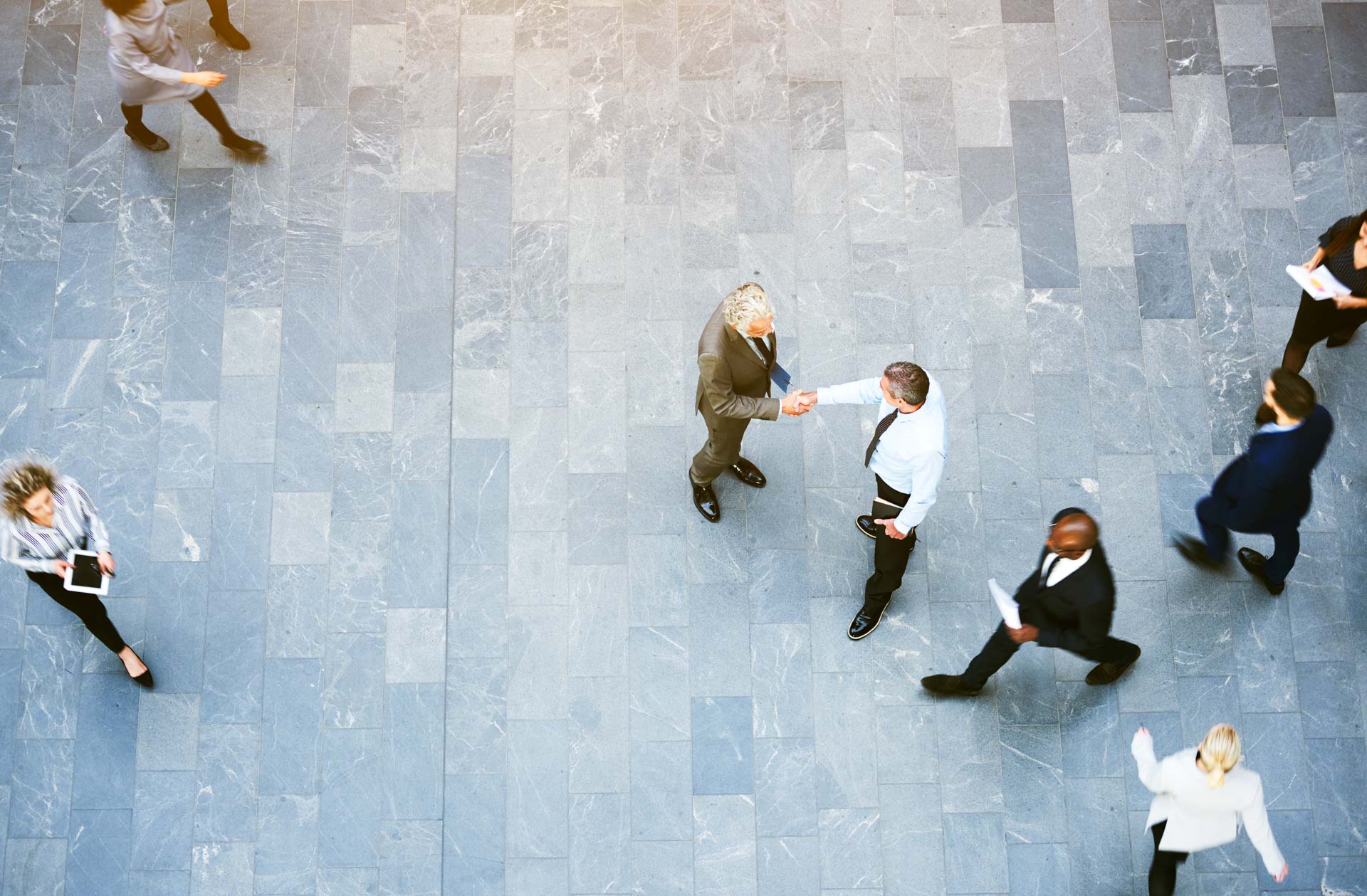 Aerial view of office workers shaking hands