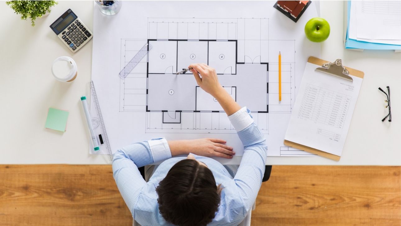 Woman working on business premises floormap