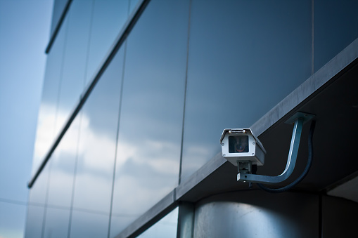 business security camera overlooking perimeter of office building 