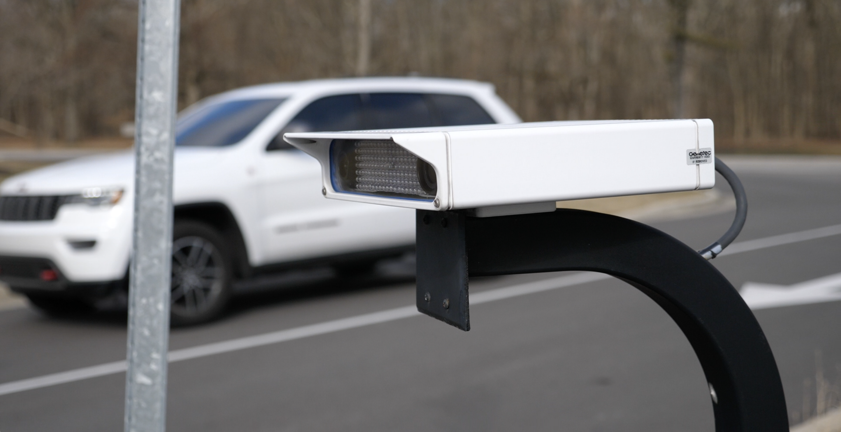 License plate recognition camera mounted on roadside.