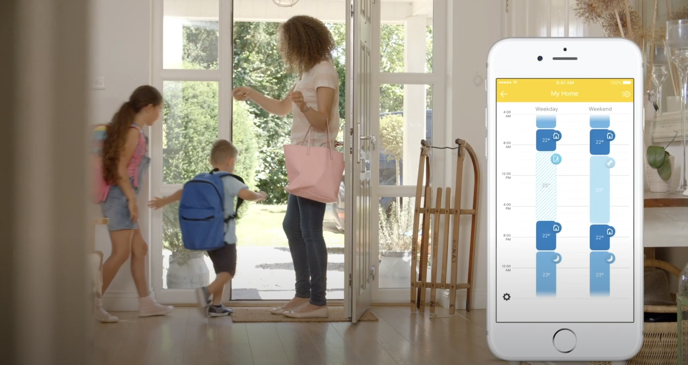 Z-Wave thermostat information displayed on smart phone in foreground with family leaving their home behind.