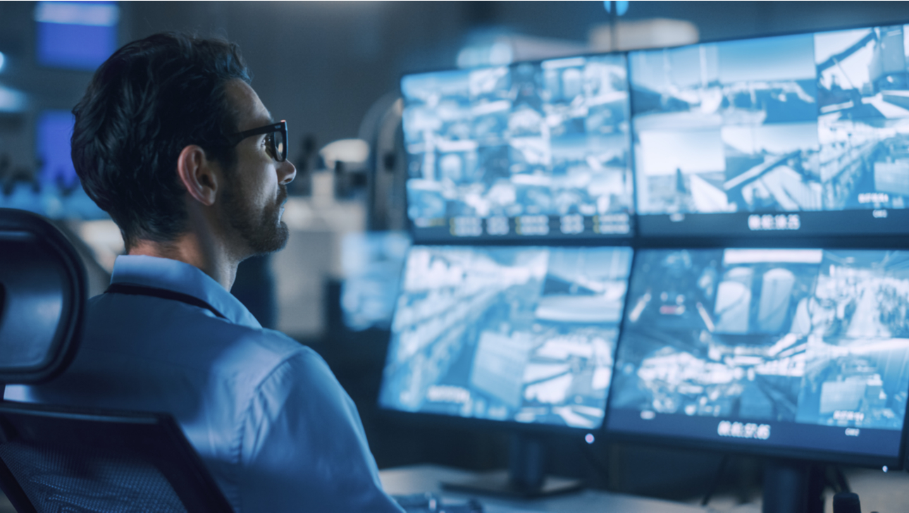 Portrait Shot of a Security Operator Controls Proper Functioning of Workshop Production Line