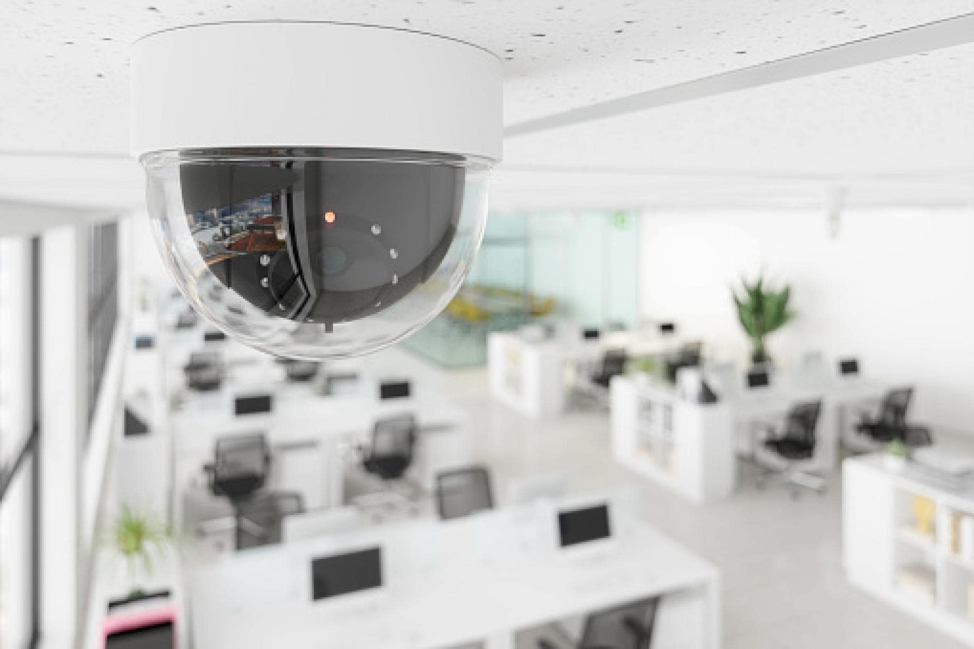 video camera installed on ceiling of interior office space 