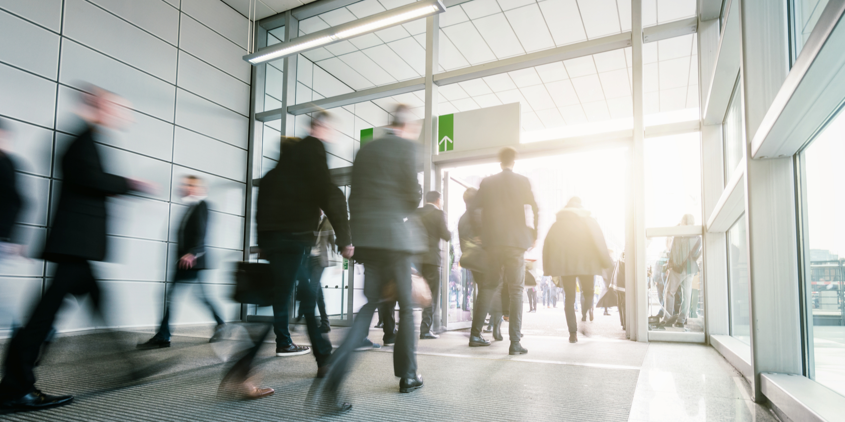 Business People Walking in a modern entrance