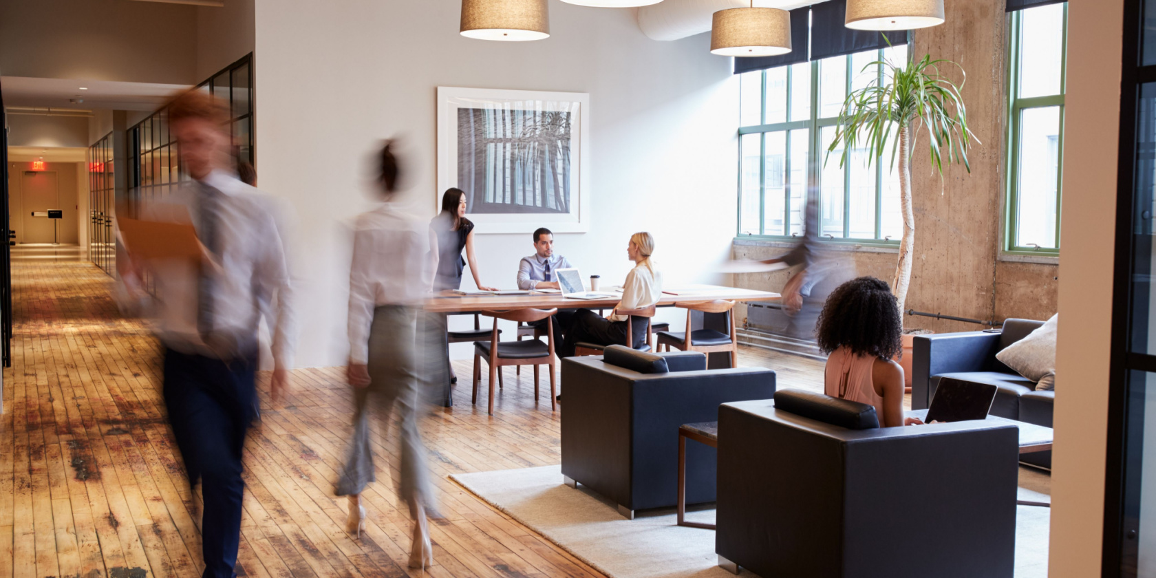 Business people at work in a busy luxury office space