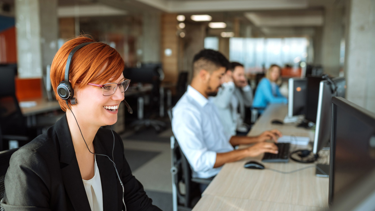 Team of business people working in a call centre on the line