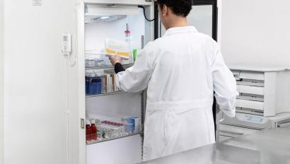 Retrieving vaccine from refrigerator monitored by Securitas Healthcare T15 tag