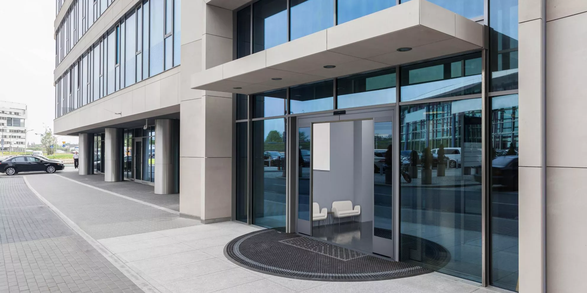 Closeup of a glass entrance to office building