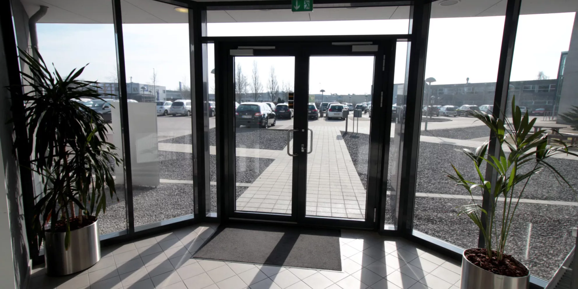 View of parking lot through lobby doors