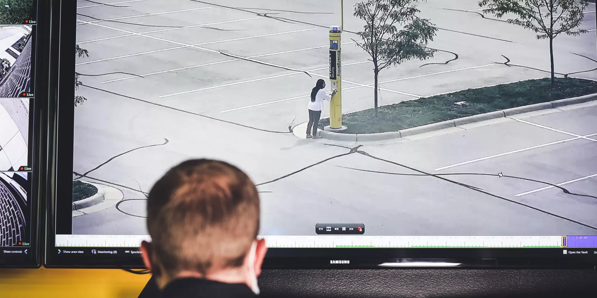 Man watches video surveillance feed