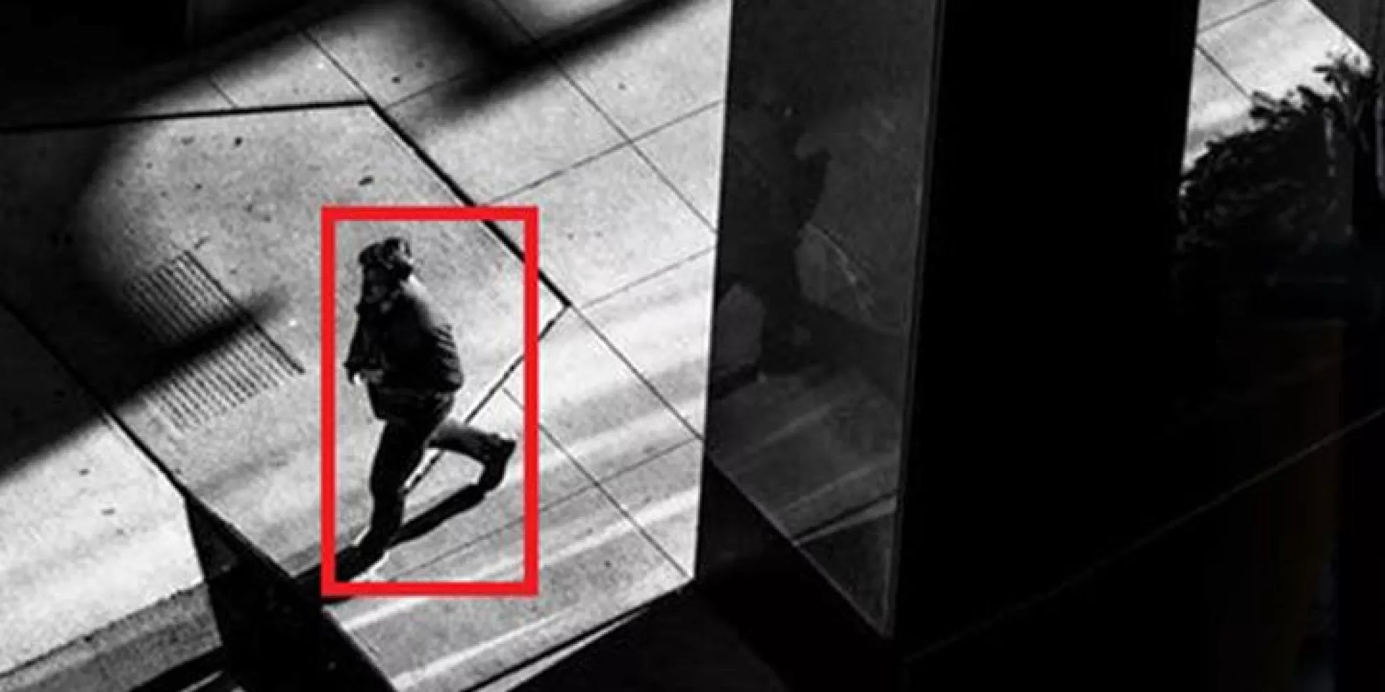 Security footage with red square around person