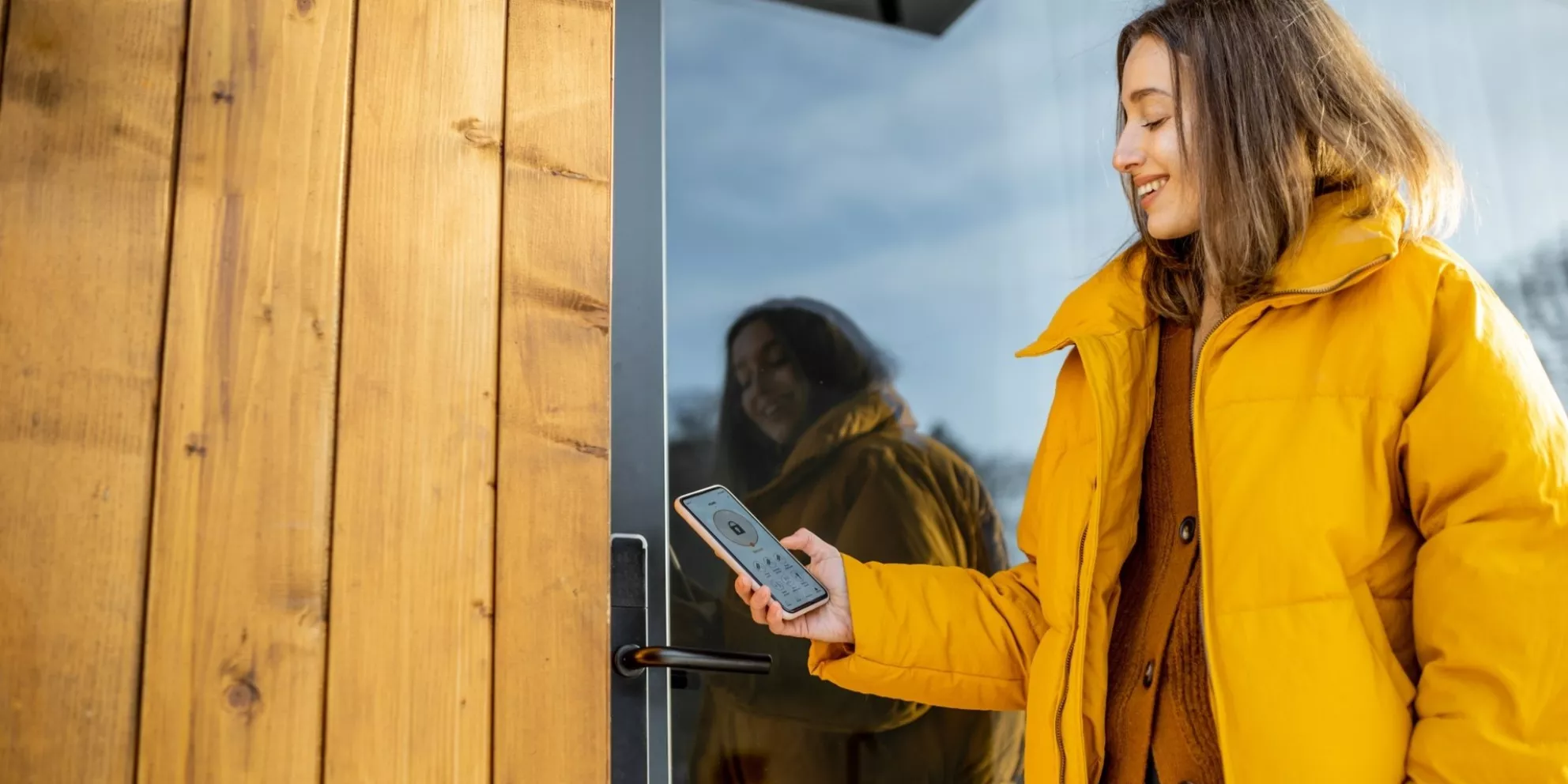 Woman using keyless access control on her smartphone.