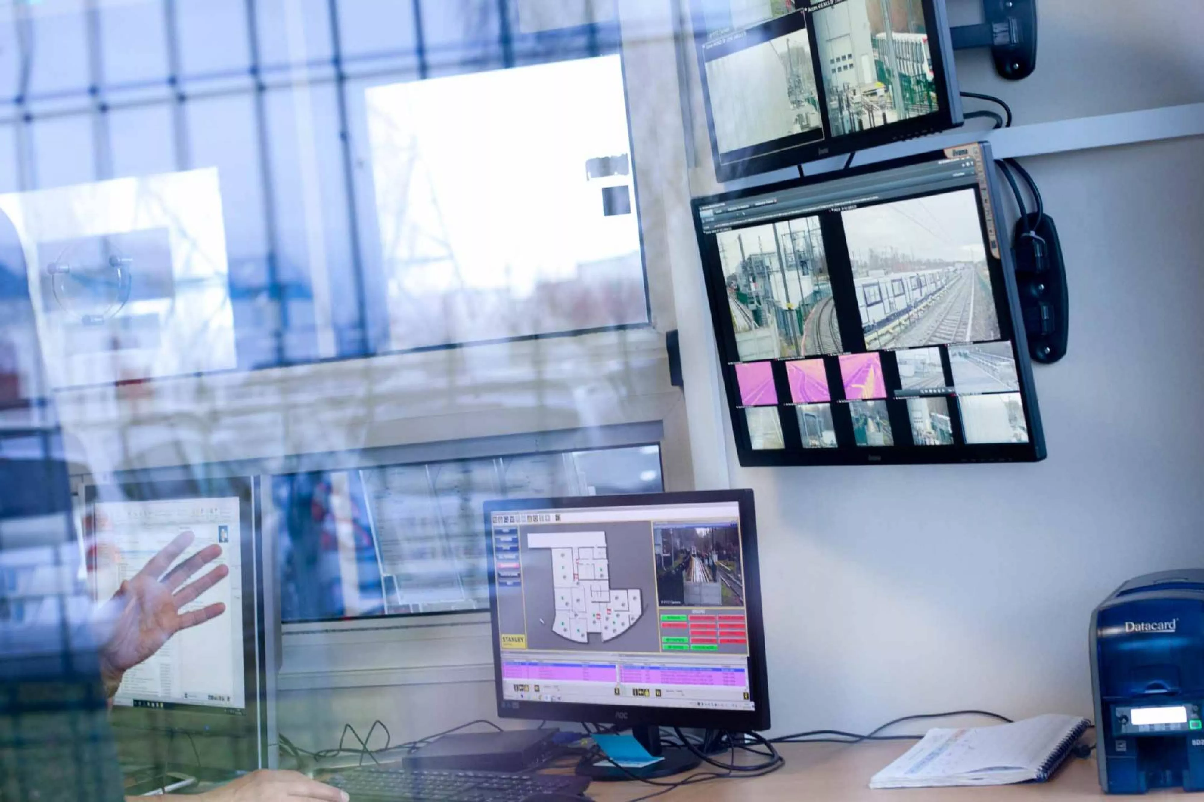 View of security monitor setup through glass