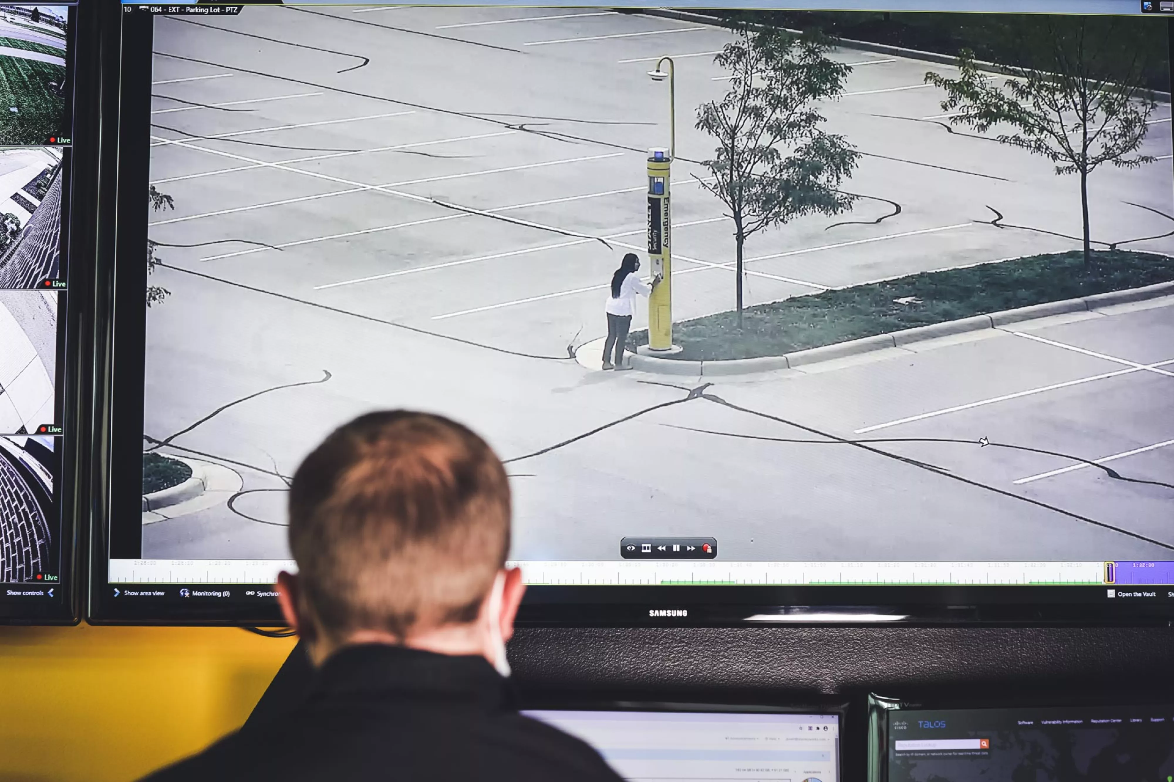 Man watches video surveillance feed