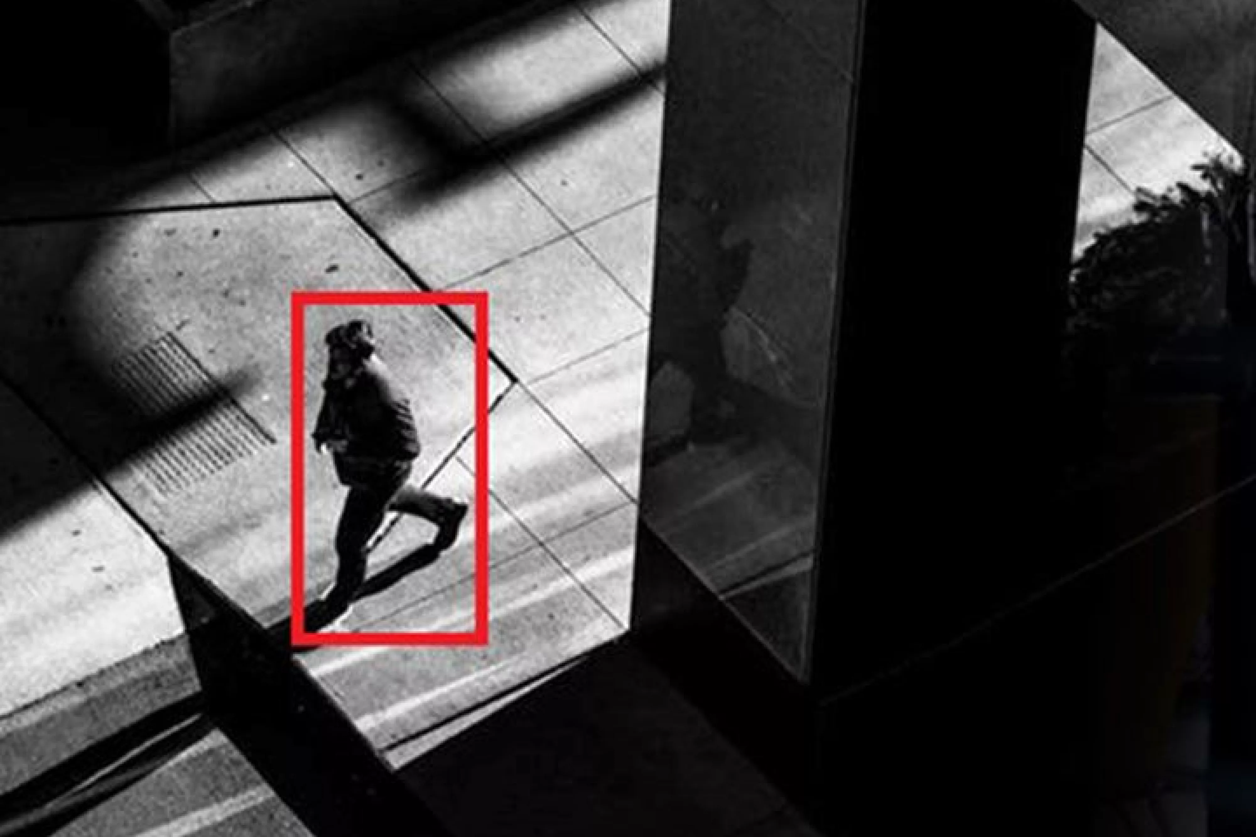 Security footage with red square around person