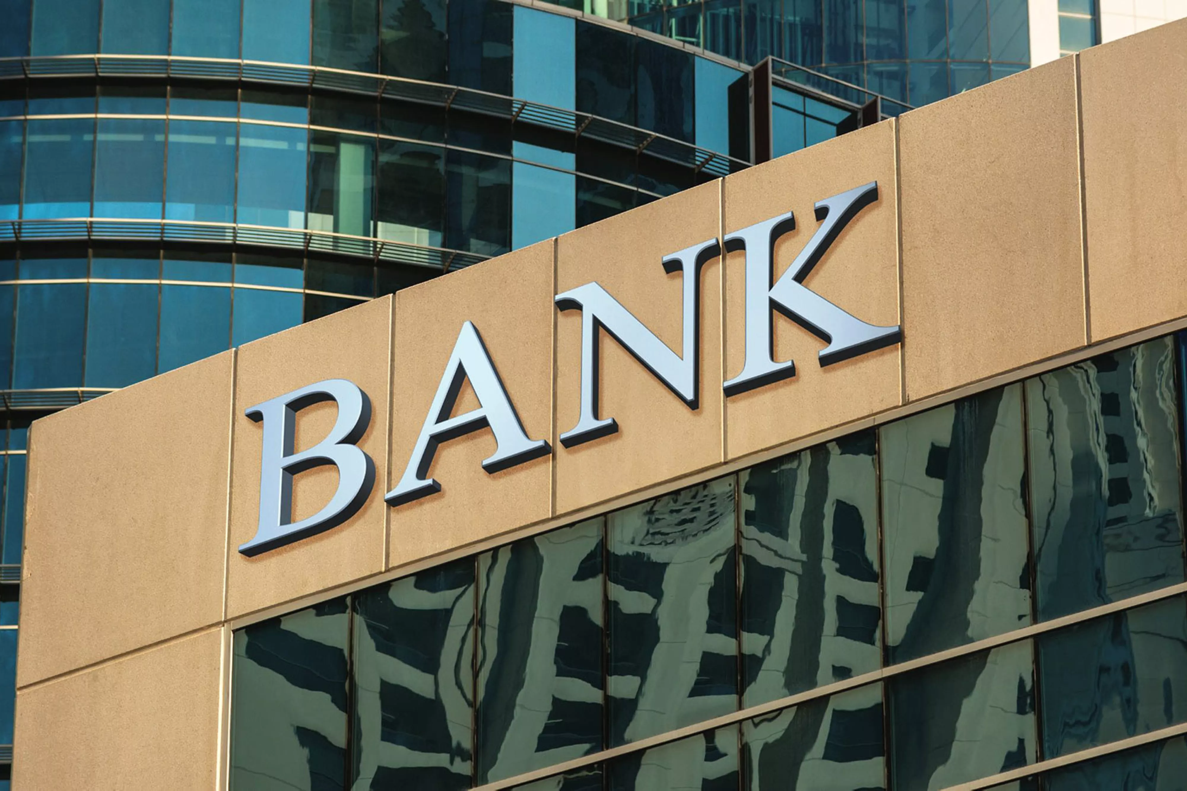 Building with "BANK" sign on front.