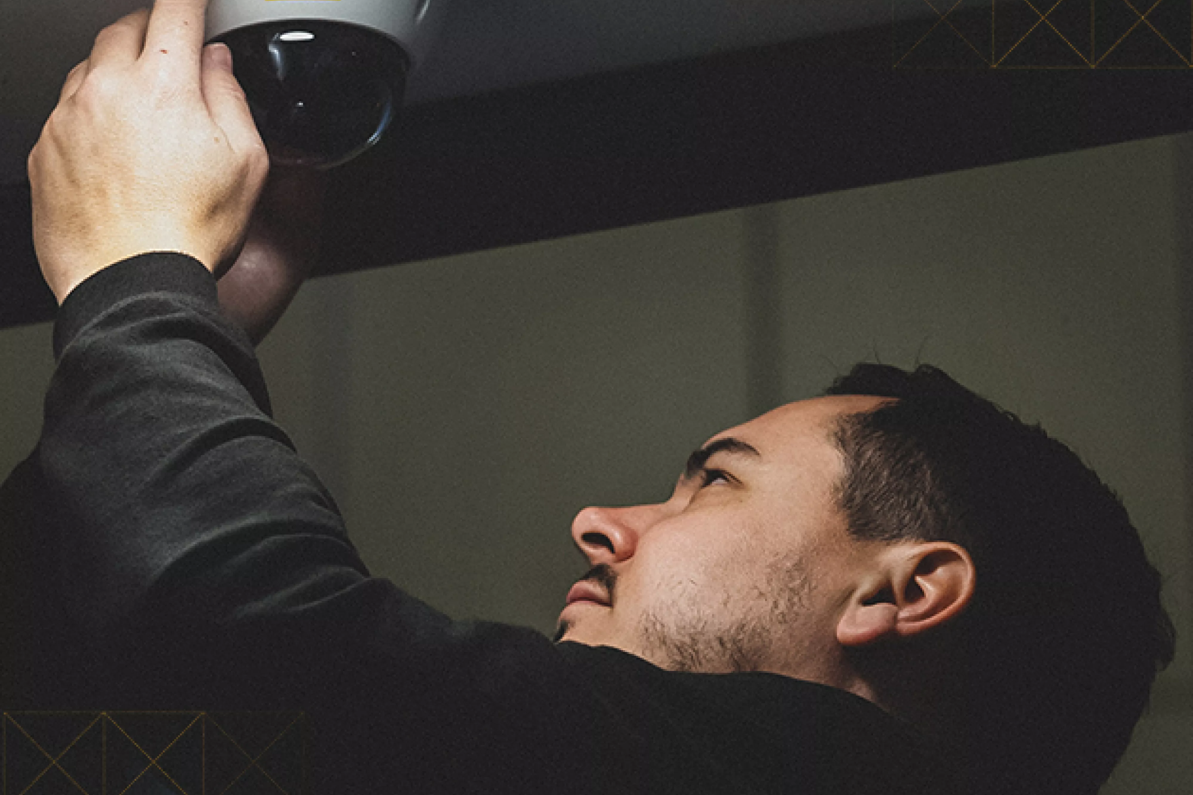 STANLEY Security technician installing camera