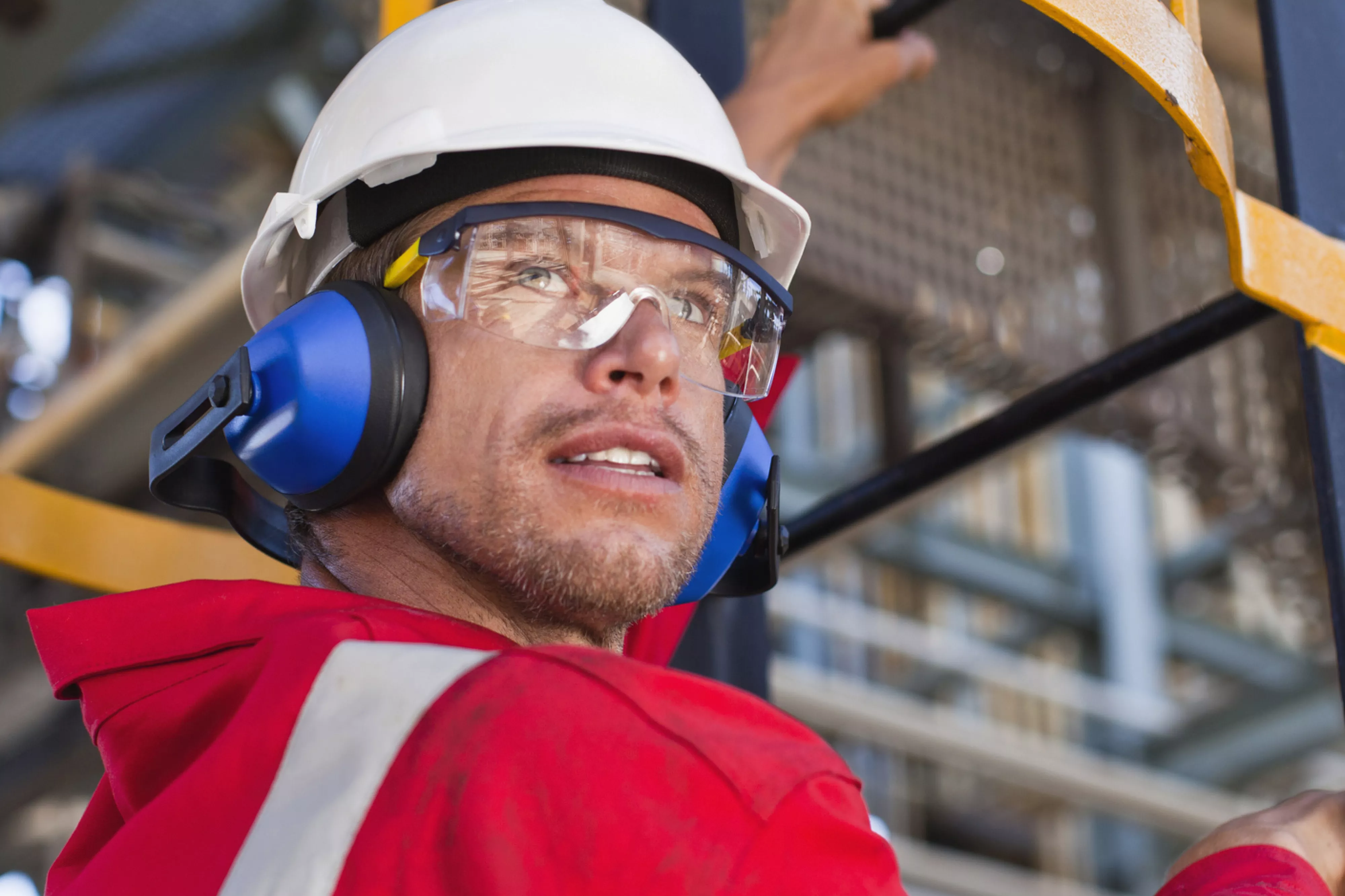 Construction worker climbing stairs