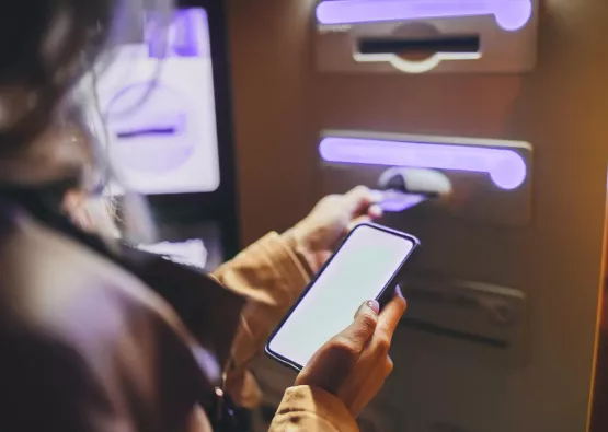 Entering a card in ATM machine at a bank