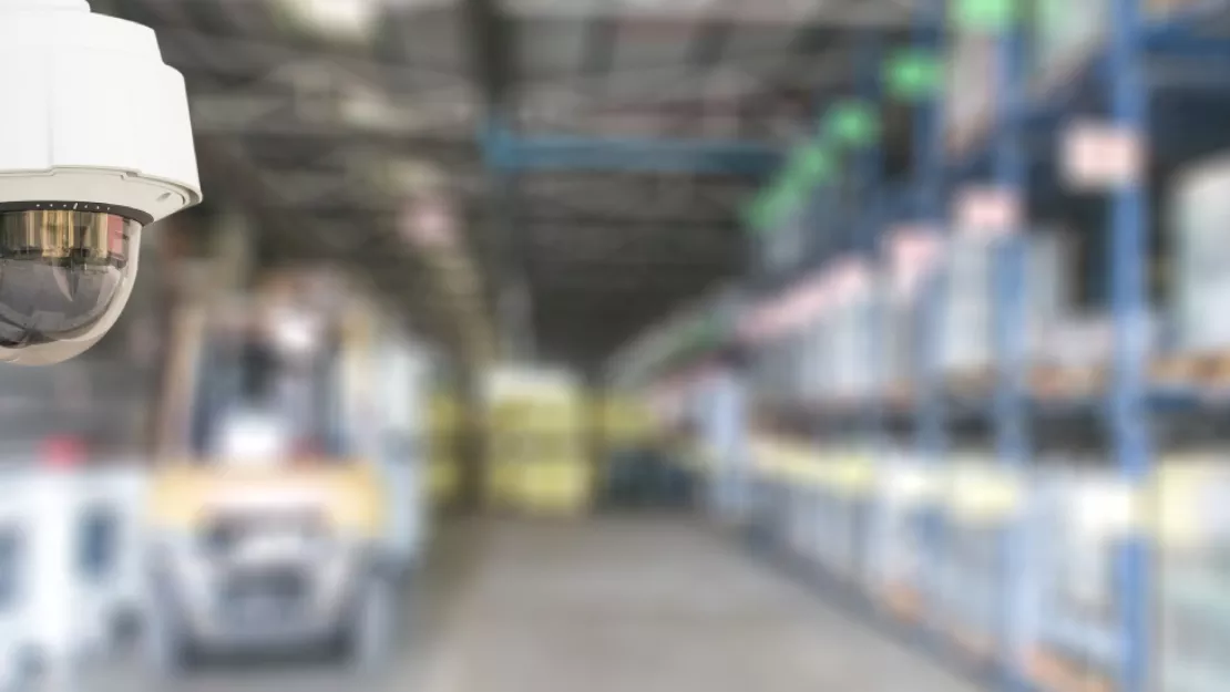 A security camera is in focus while the background is blurry