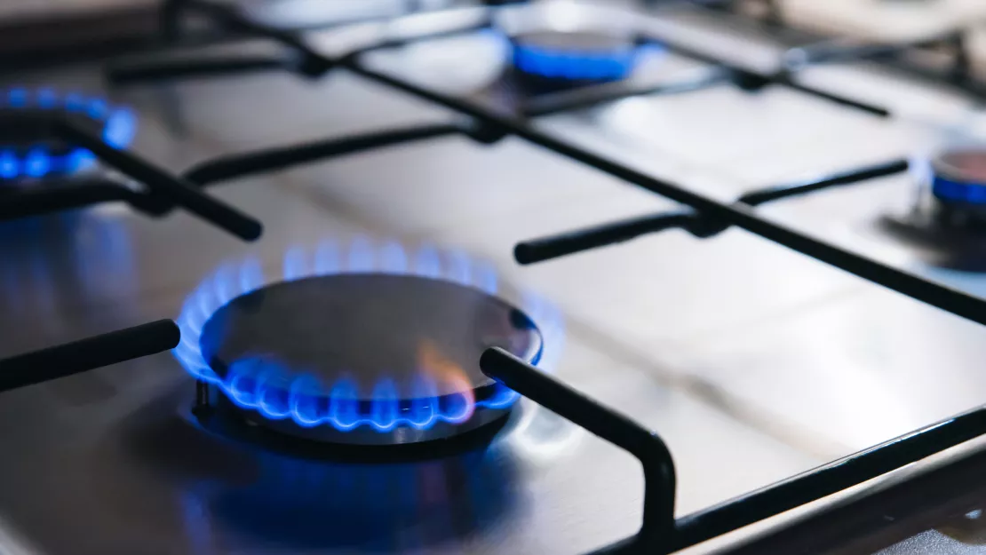 Lit burners on gas stove.