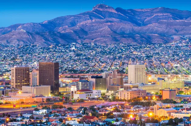 El Paso, Texas, USA  downtown city skyline at dusk with Juarez, Mexico in the distance.