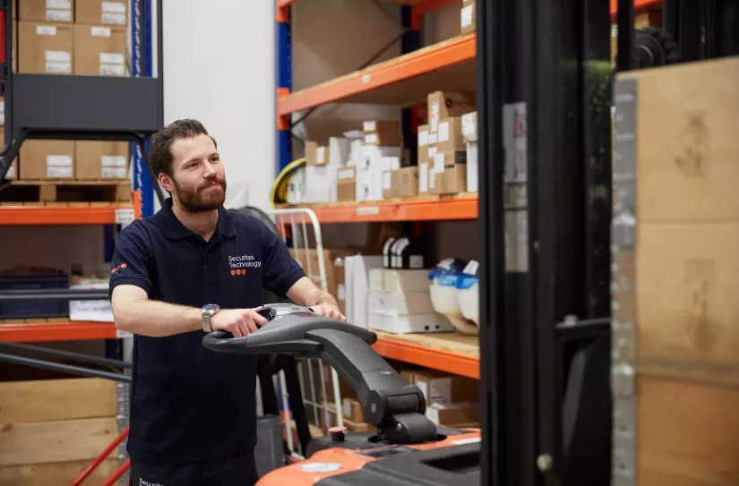 Employee in warehouse equipped with electronic security