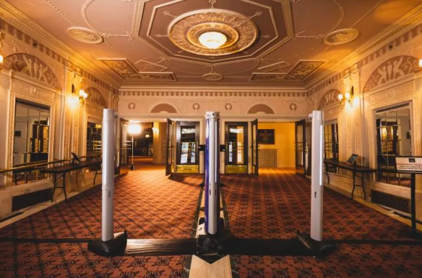 weapons detection system at entrance of event venue building entering into lobby