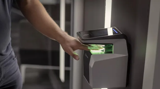 Hand scanning a biometric commercial access control card reader 