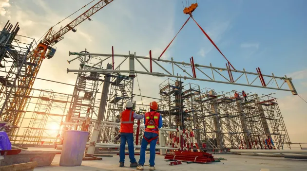 Construction worker truss installation