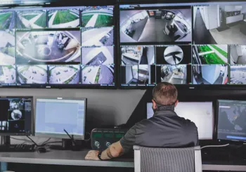 video monitoring screens at a security monitoring center 