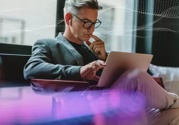 SecTech_2022_ManOnLaptop_AdobeStock_336028070_DOTS_PURPLE_EDIT