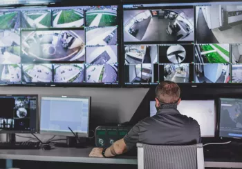 video monitoring screens at a security monitoring center