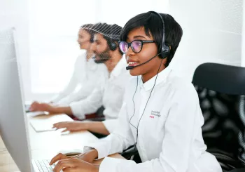 Security monitoring employee providing support for security system 24/7 monitoring services