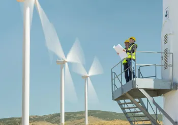 SecTech_2025_Energy_Workers Surveying Wind Turbines_AdobeStock_357290425