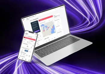 Laptop and mobile phone displaying the SecureStat HQ interface with Cumulus cloud video surveillance platform interface with live monitoring on screen.