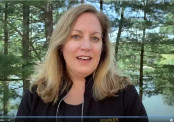 Woman speaking near forest lake