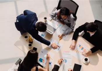Top view in office while people having a meeting