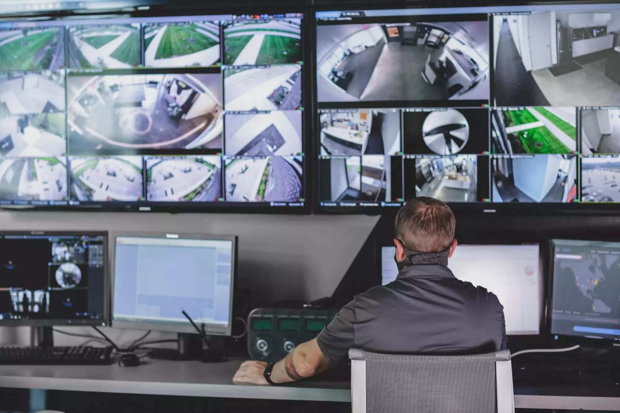 video monitoring screens at a security monitoring center 