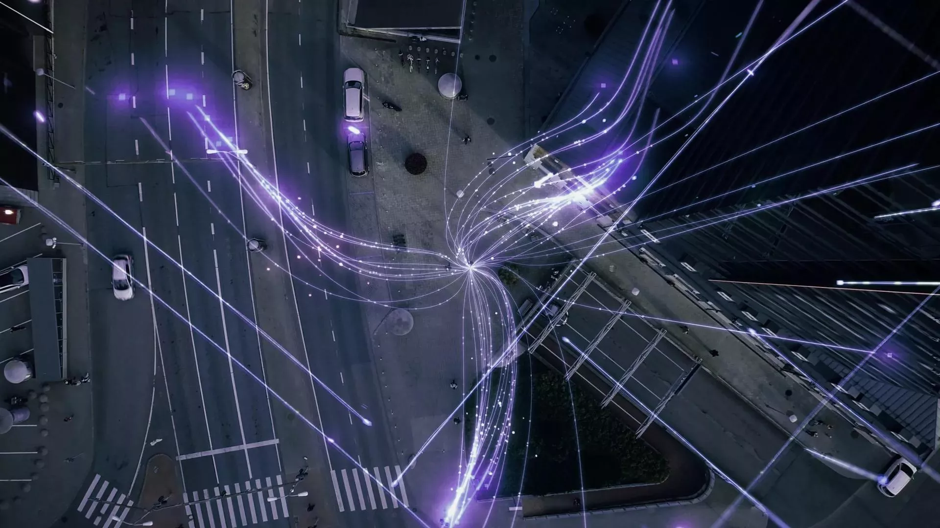 Bovenaanzicht van een straat met data connectiviteit die bepaalde richtingen opstralen.